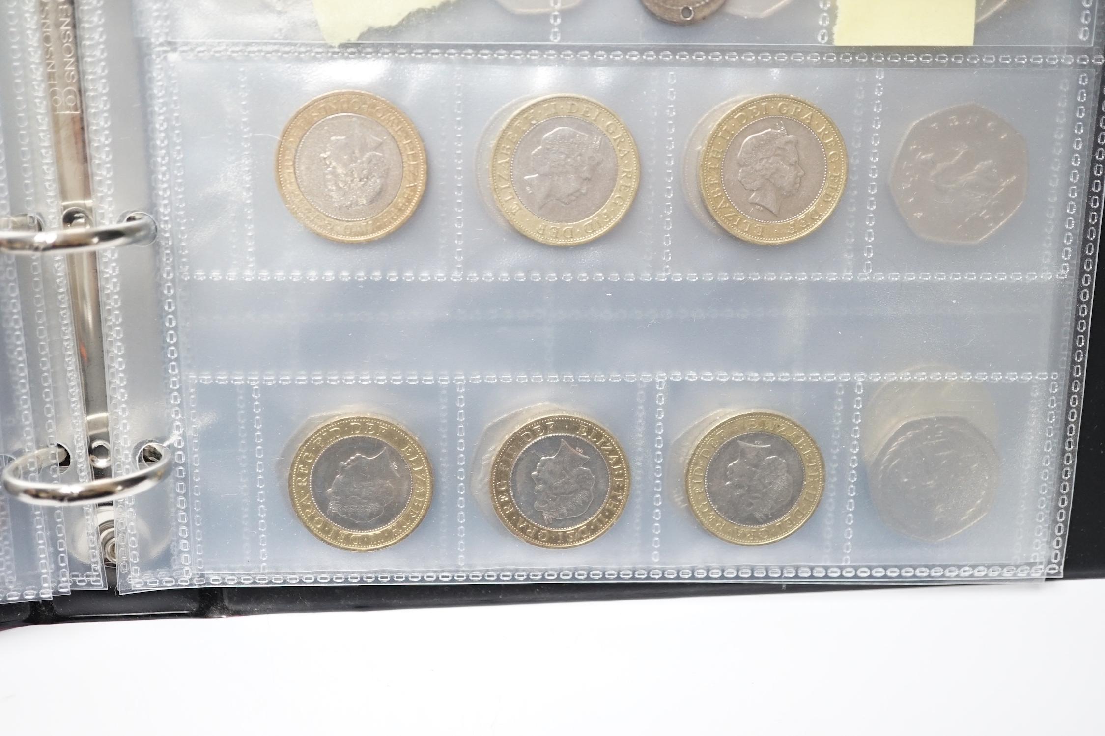 A stamp album, alphabetically mounted by country, mostly early 20th century, including some Commonwealth mounted mint, together with an album of mainly British coinage, 20th century, but includes two Roman AR denarius